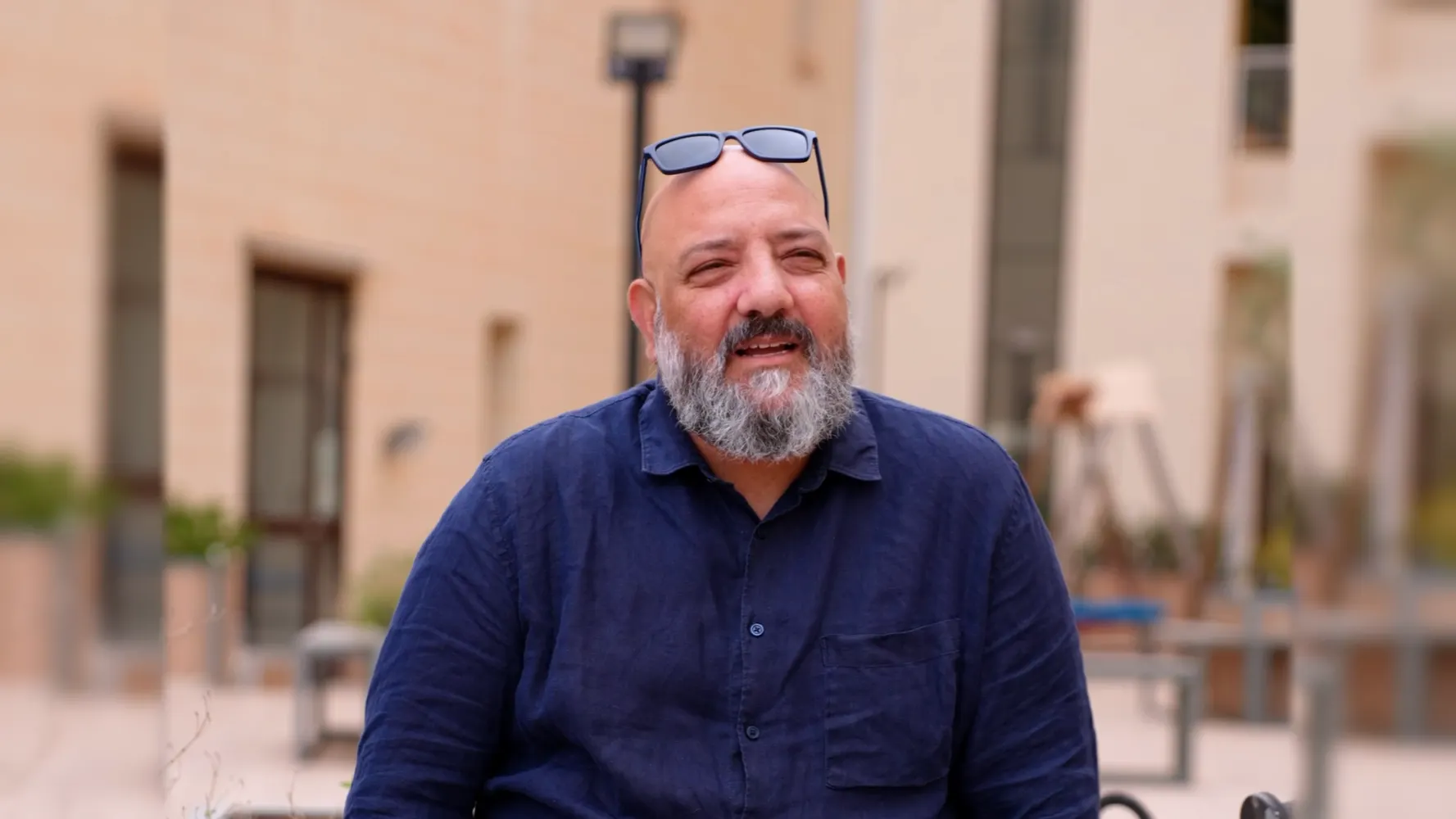 Interview filmed outdoors in a courtyard