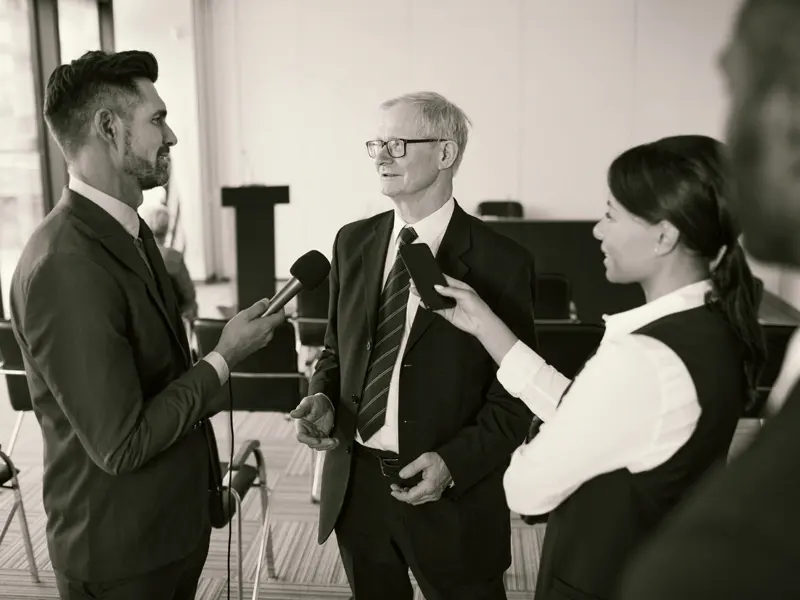 Business leader being interviewed on camera in an office setting